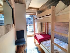 En eller flere senge i et værelse på Annapurna-appartement-6pers-proche centre + 7 billeder