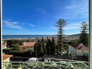 a view of a city and the ocean from a balcony at 5 mn du centre de Beaulieu. in Beaulieu-sur-Mer