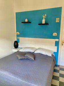 Postel nebo postele na pokoji v ubytování Hotel Villa Pozzi