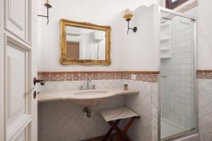 a bathroom with a sink and a mirror at Villa lady olimpia in Palermo +15 photos