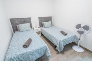 A bed or beds in a room at Paquesito Home