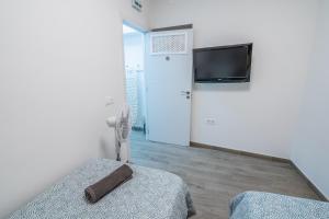 A television and/or entertainment centre at Paquesito Home