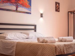 A bed or beds in a room at Aliva apartment LT