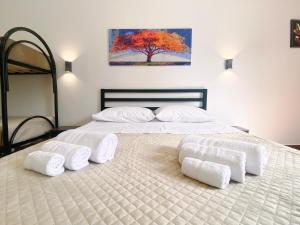 A bed or beds in a room at Aliva apartment LT