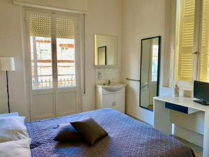 Postel nebo postele na pokoji v ubytování Hotel Villa Pozzi
