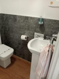 a bathroom with a sink and a toilet at Relaxing secluded lodge couples getaway with hot tub in Eaton