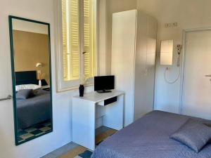 Postel nebo postele na pokoji v ubytování Hotel Villa Pozzi