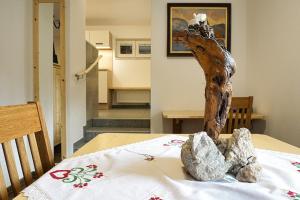 a table with two rocks on top of a table at Apartment Pr'pek in Bohinj