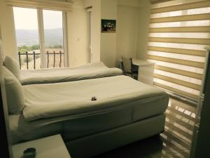 Postel nebo postele na pokoji v ubytování HD Miray Otel