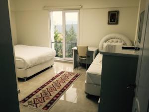 Postel nebo postele na pokoji v ubytování HD Miray Otel