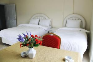 Postel nebo postele na pokoji v ubytování HD Miray Otel