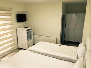 Postel nebo postele na pokoji v ubytování HD Miray Otel