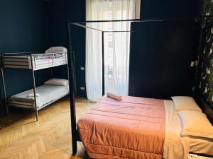 a bedroom with a bunk bed and a window at Maya Rooms in Milan