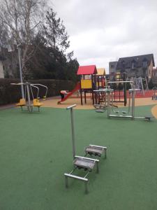 an empty playground with a chair in a park at Apartament Morski nr 4 Baltic Nova in Władysławowo