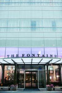 a building with a sign that reads the entrance to a building at The Fontaine in Kansas City