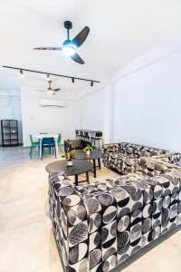 a living room with couches and tables and a ceiling at Apartment 34 in Derech Jaffa in Tel Aviv