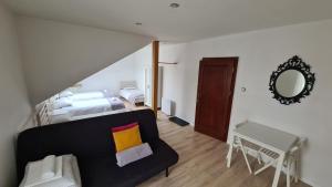 a living room with a couch and a bed and a mirror at ALDAMI in Warsaw +67 photos