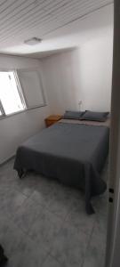 Un pat sau paturi într-o cameră la Alquile por día Casa ñoño