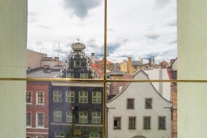 a view of a city from a window at Green Hostel in Toruń