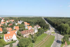 an aerial view of a town with houses and a road at B&B Villa Fernadine in De Haan