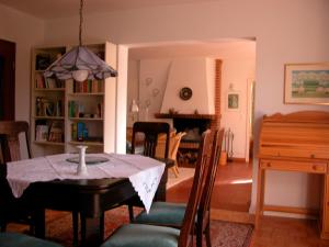 a dining room and living room with a table and chairs at Silva Mare, EG in Kellenhusen