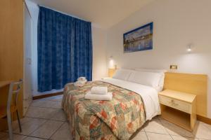 Posteľ alebo postele v izbe v ubytovaní Hotel New Aurora Venice