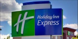a sign for a holiday inn express on a building at Holiday Inn Express Corpus Christi - Beachfront, an IHG Hotel in Corpus Christi