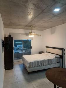 Postel nebo postele na pokoji v ubytování Monoambiente en Rosario