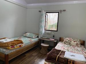 Katil atau katil-katil dalam bilik di Pakha Dhim Homestay Namchi