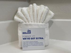 a white towel sitting on top of a shelf at Holiday Inn Express Burlington, an IHG Hotel in Burlington
