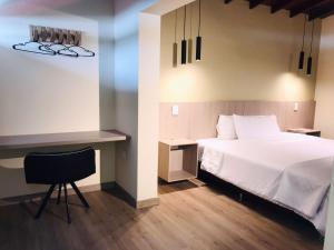 Postel nebo postele na pokoji v ubytování Hotel & Golf Isak Aeropuerto