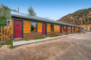 a row of cabins with colorful doors on a building at Lift Landing in Idaho Springs