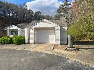 a house with a garage in a driveway at Entire 2 Bedroom Apt Home in Sandy Springs in Sandy Springs