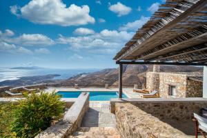 a villa with a swimming pool with a view at La Casa del Pastore in Serifos Chora