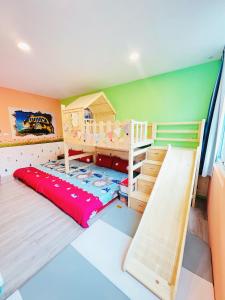 a childrens room with a bunk bed and a bunk bed frame at 享樂時光親子民宿 in Tainan