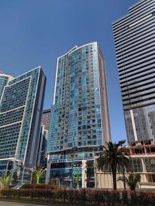 a group of tall buildings in a city at Dream apartment in Batumi