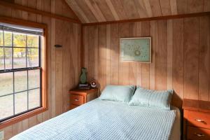 Postel nebo postele na pokoji v ubytování neversink river resort