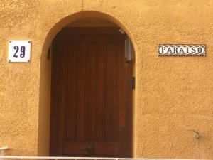 a door to a building with a sign on it at Paraíso in Cumbre del Sol
