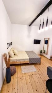a bedroom with a bed in a room at Sebastian`s stylish apartment in old town in Tbilisi City +20 photos