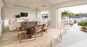 a dining room and living room with a table and chairs at Palm Cay Marina and Resort in Nassau