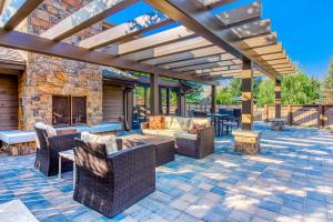 an outdoor patio with furniture and a fireplace at Snowcreek 1536 in Sun Valley