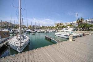 a group of boats docked in a marina at Le Bella Vista Vue Port Carnon Proche Plage in Mauguio