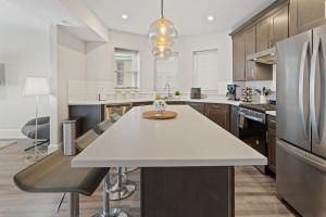 A kitchen or kitchenette at Steps from the Beach Spacious Modern 4BR 2BA Apt