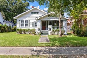 a white house with a tree in the yard at Cottontown 3BR - Mins to USC in Columbia