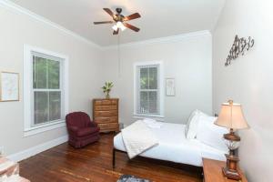 a bedroom with a bed and a ceiling fan at Spacious 5BR - Pet Friendly in Columbia