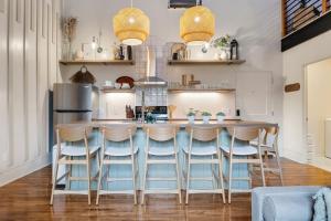 a kitchen with a table and chairs in a kitchen at Alchemist - The Vestry on Read in Columbia