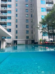 an empty swimming pool in front of a building at CUSHY DORM at KLCC in Kuala Lumpur