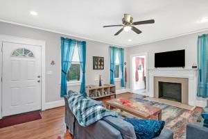 a living room with a couch and a fireplace at Unique 3BR - Sleeps 6 in Columbia