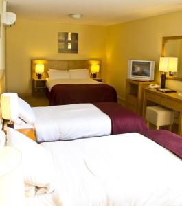Voodi või voodid majutusasutuse Upton Court Hotel toas