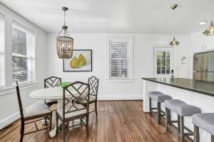 a kitchen and dining room with a table and chairs at Modern Gem in Columbia in Columbia +15 photos